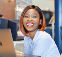 A partner reviewing an outcome report on a laptop